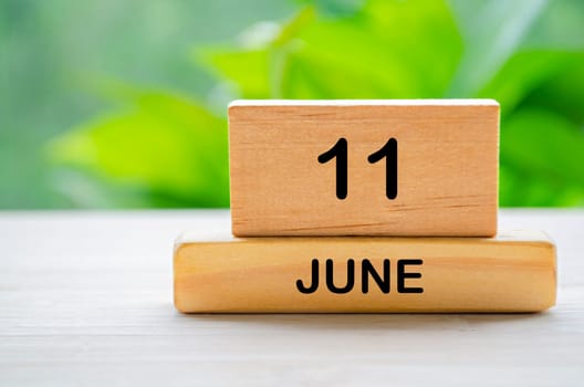 11 June wooden calendar with customizable space for text or ideas. June month concept