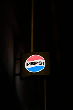 Dresden, Germany – January 16, 2025: Illuminated sign for the Pepsi-Cola brand of the manufacturer PepsiCo in the city center of Dresden, Germany