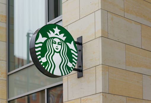 Dresden, Germany – January 16, 2025: Neon sign for the global coffee house chain Starbucks in the city center of Dresden, Germany
