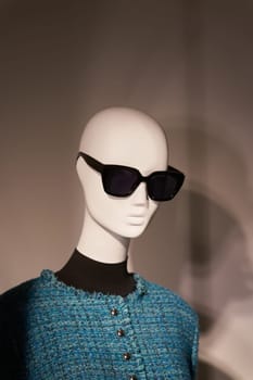 Mannequin with sunglasses in a shop window in the city center of Dresden, Germany