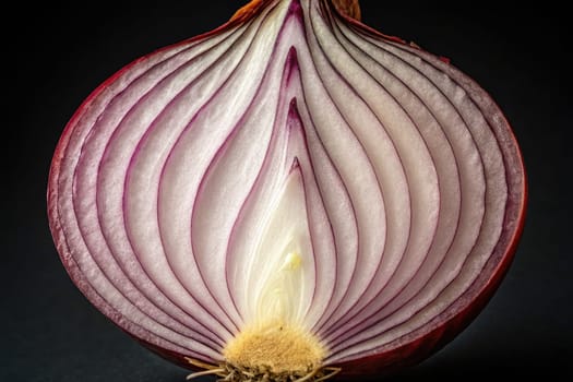 A red onion cut in half reveals its internal layers, showcasing a mix of purple and white shades. The delicate structure and textures create a visually appealing cross-section.