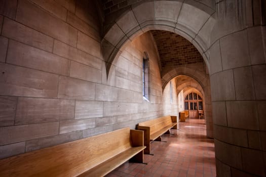 The long hallway with stone arches inside St Johns church in Spokane, Washington.