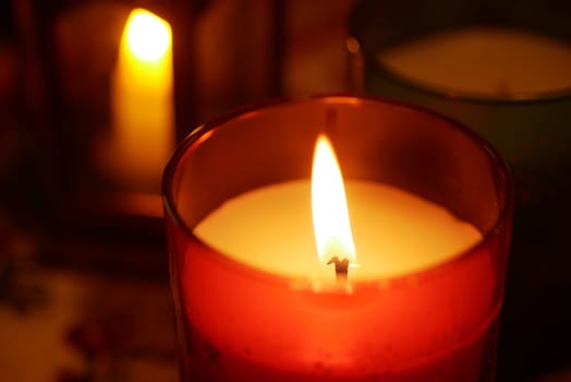 Candles cast a soft glow, creating a tranquil ambiance in a room.