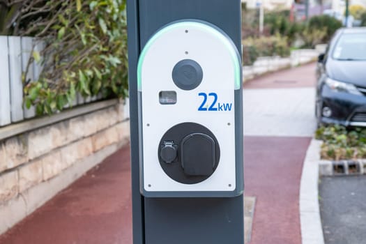 City street power hub providing eco-friendly sustainable supply for EV vehicle. Plug for charging electric car. Renewable clean energy for eco awareness lifestyle concept in Paris