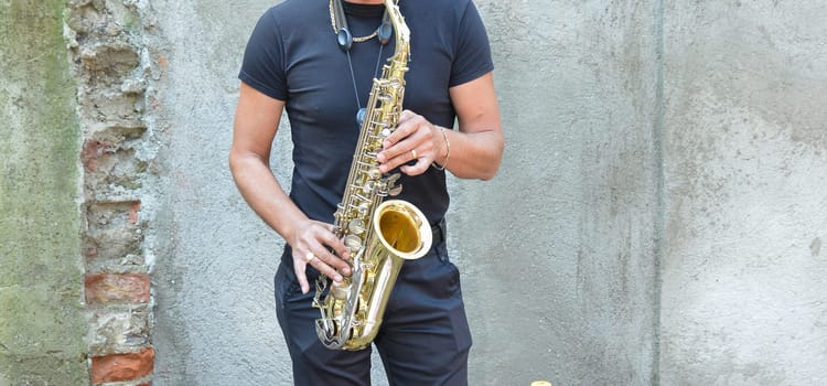A talented saxophonist plays passionately, bringing music to life.