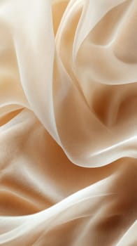 A smooth fabric in beige and cream hues lays elegantly on a flat surface, displaying its soft texture and gentle folds, creating a serene and inviting atmosphere.