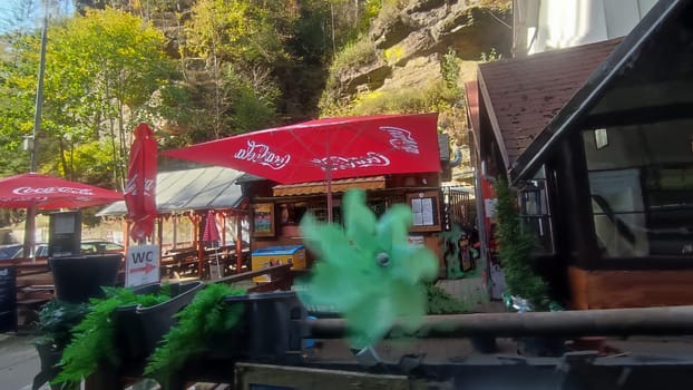 October 17 2024 Hrensko Czech Republic Europe Outdoor cafe umbrellas outdoor shotlisttravel travel tourism objects architecture street building . High quality photo