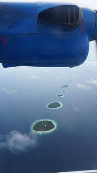 The breathtaking view of the maldives islands from a seaplane, showcasing the turquoise waters and lush greenery, creates an unforgettable travel experience