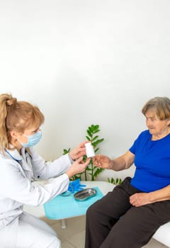 Elderly woman at a doctor appointment. Selective focus. People.