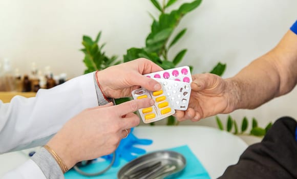 Elderly woman at a doctor appointment. Selective focus. People.