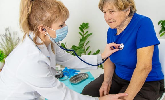 Elderly woman at a doctor appointment. Selective focus. People.