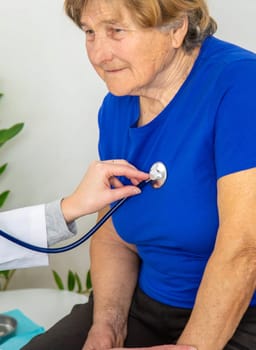 Elderly woman at a doctor appointment. Selective focus. People.