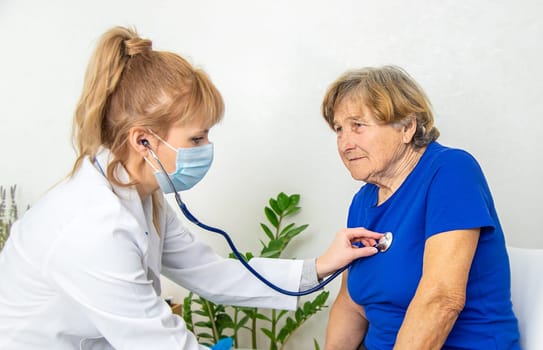 Elderly woman at a doctor appointment. Selective focus. People.
