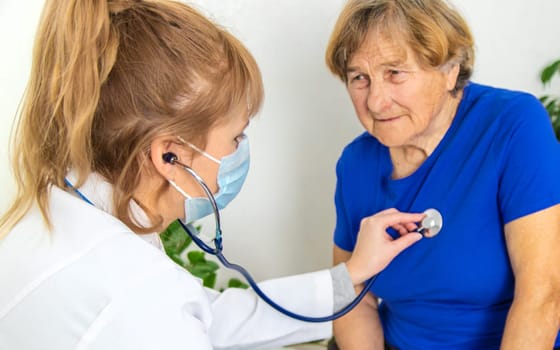 Elderly woman at a doctor appointment. Selective focus. People.
