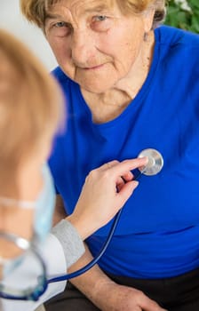 Elderly woman at a doctor appointment. Selective focus. People.
