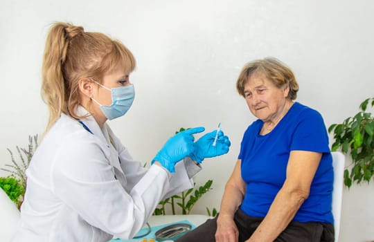 Elderly woman at a doctor appointment. Selective focus. People.