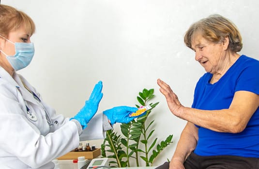 Elderly woman at a doctor appointment. Selective focus. People.