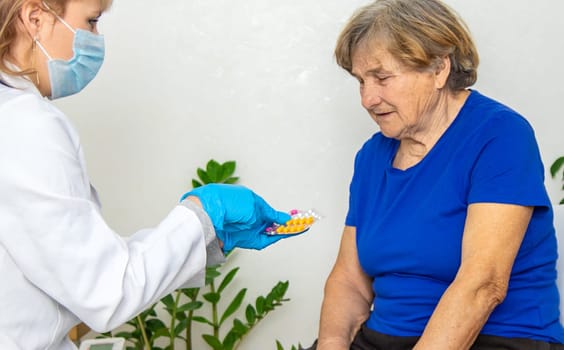 Elderly woman at a doctor appointment. Selective focus. People.