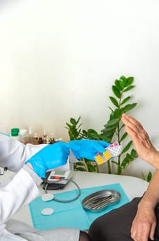 Elderly woman at a doctor appointment. Selective focus. People.