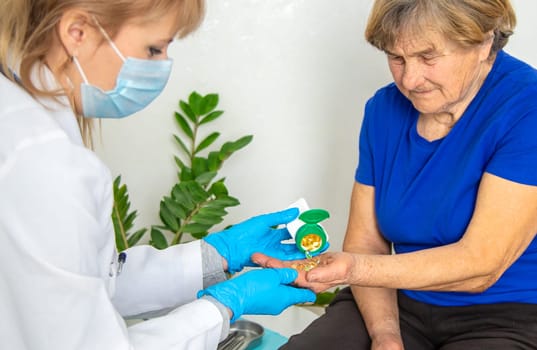 Elderly woman at a doctor appointment. Selective focus. People.