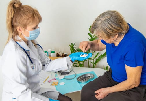 Elderly woman at a doctor appointment. Selective focus. People.
