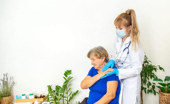 Elderly woman at a doctor appointment. Selective focus. People.