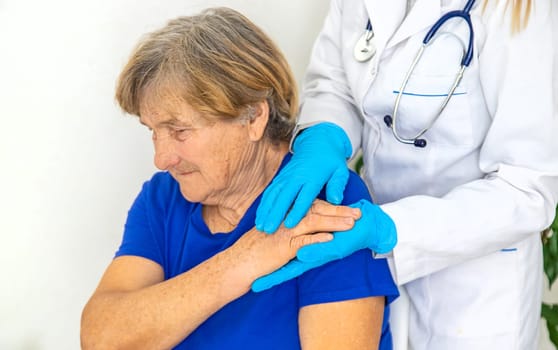 Elderly woman at a doctor appointment. Selective focus. People.