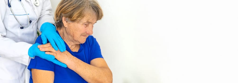 Elderly woman at a doctor appointment. Selective focus. People.