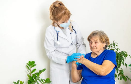 Elderly woman at a doctor appointment. Selective focus. People.