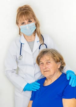 Elderly woman at a doctor appointment. Selective focus. People.