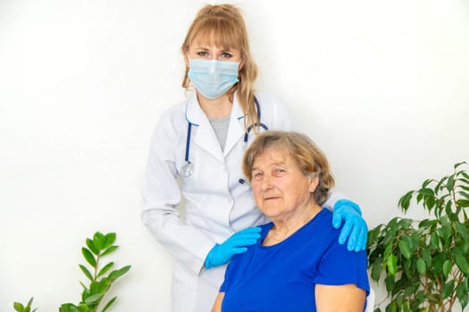 Elderly woman at a doctor appointment. Selective focus. People.