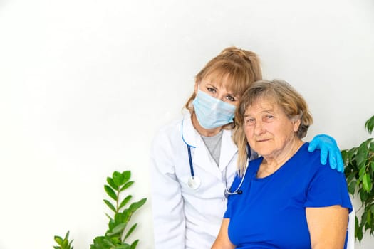 Elderly woman at a doctor appointment. Selective focus. People.