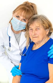 Elderly woman at a doctor appointment. Selective focus. People.