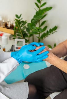 Elderly woman at a doctor appointment. Selective focus. People.