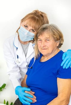 Elderly woman at a doctor appointment. Selective focus. People.