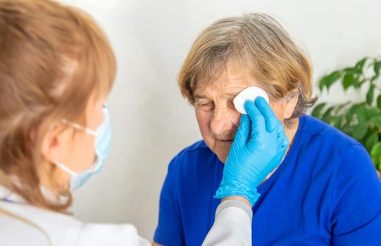 Elderly woman at a doctor appointment. Selective focus. People.