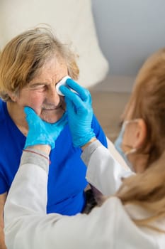 Elderly woman at a doctor appointment. Selective focus. People.