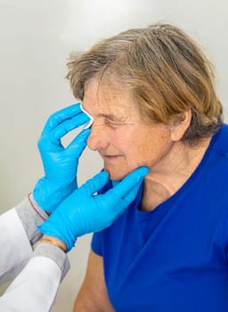 Elderly woman at a doctor appointment. Selective focus. People.