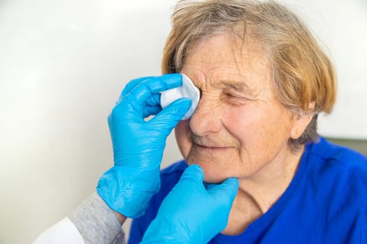 Elderly woman at a doctor appointment. Selective focus. People.