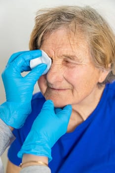 Elderly woman at a doctor appointment. Selective focus. People.