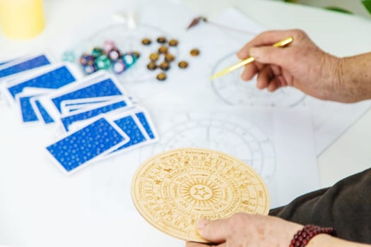 Astrology and fortune telling old fortune teller. Selective focus. people.