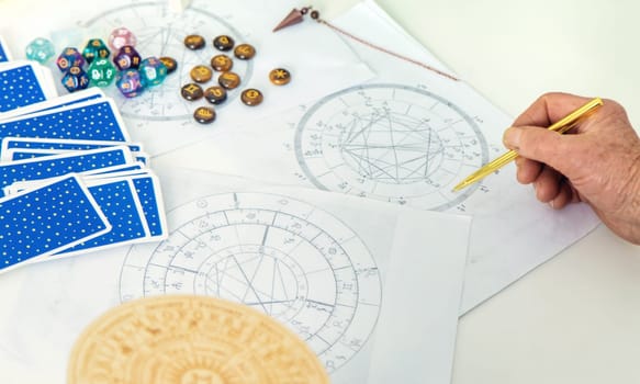 Astrology and fortune telling old fortune teller. Selective focus. people.