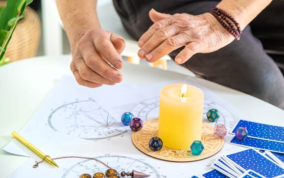 Astrology and fortune telling old fortune teller. Selective focus. people.