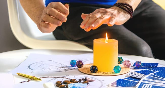 Astrology and fortune telling old fortune teller. Selective focus. people.