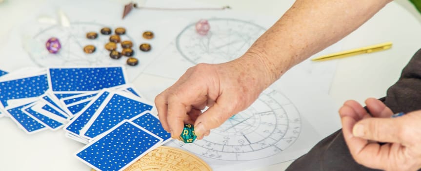 Astrology and fortune telling old fortune teller. Selective focus. people.