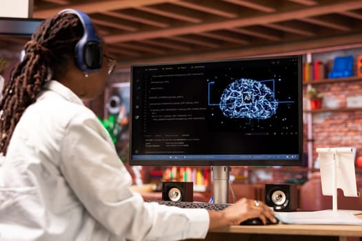 Admin writing code on computer and doing maintenance on artificial intelligence neural networks, listening music. Tech support expert wearing headphones typing on keyboard, doing checkup on AI systems