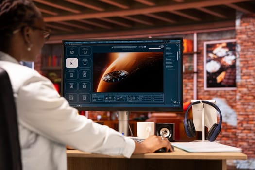 Woman in home office getting tasks done with AI program turning text prompt into videos. Close up of person using computer to make use of text to video artificial intelligence generative models
