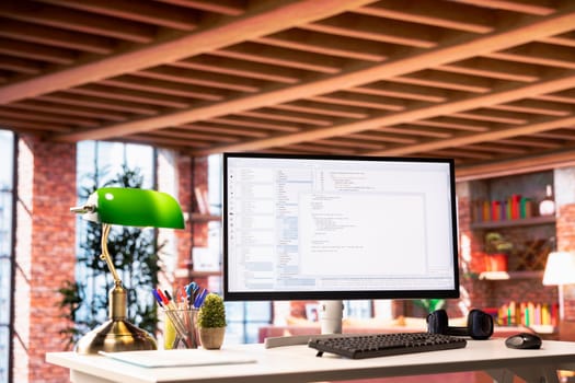 Software development and coding being done on PC screen, implementing algorithms. Code editor on computer display in home office used for building applications and optimizing performance