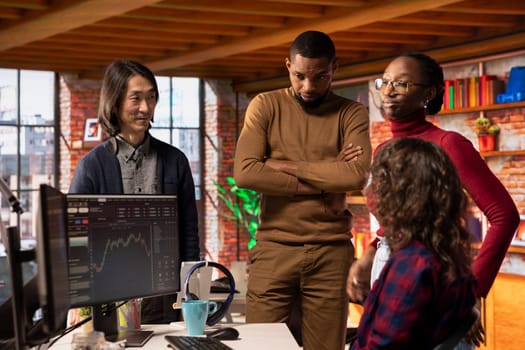 Startup team cheering after company goes public through IPO, obtaining capital by offering shares. Venture business securing angel investments after innovative growth strategy