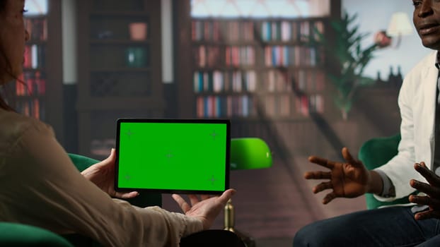 African American medic sharing his feelings next to green screen, PTSD and frustration that comes with the medical career. Doctor suffering after losing patients, mental health. Camera A.